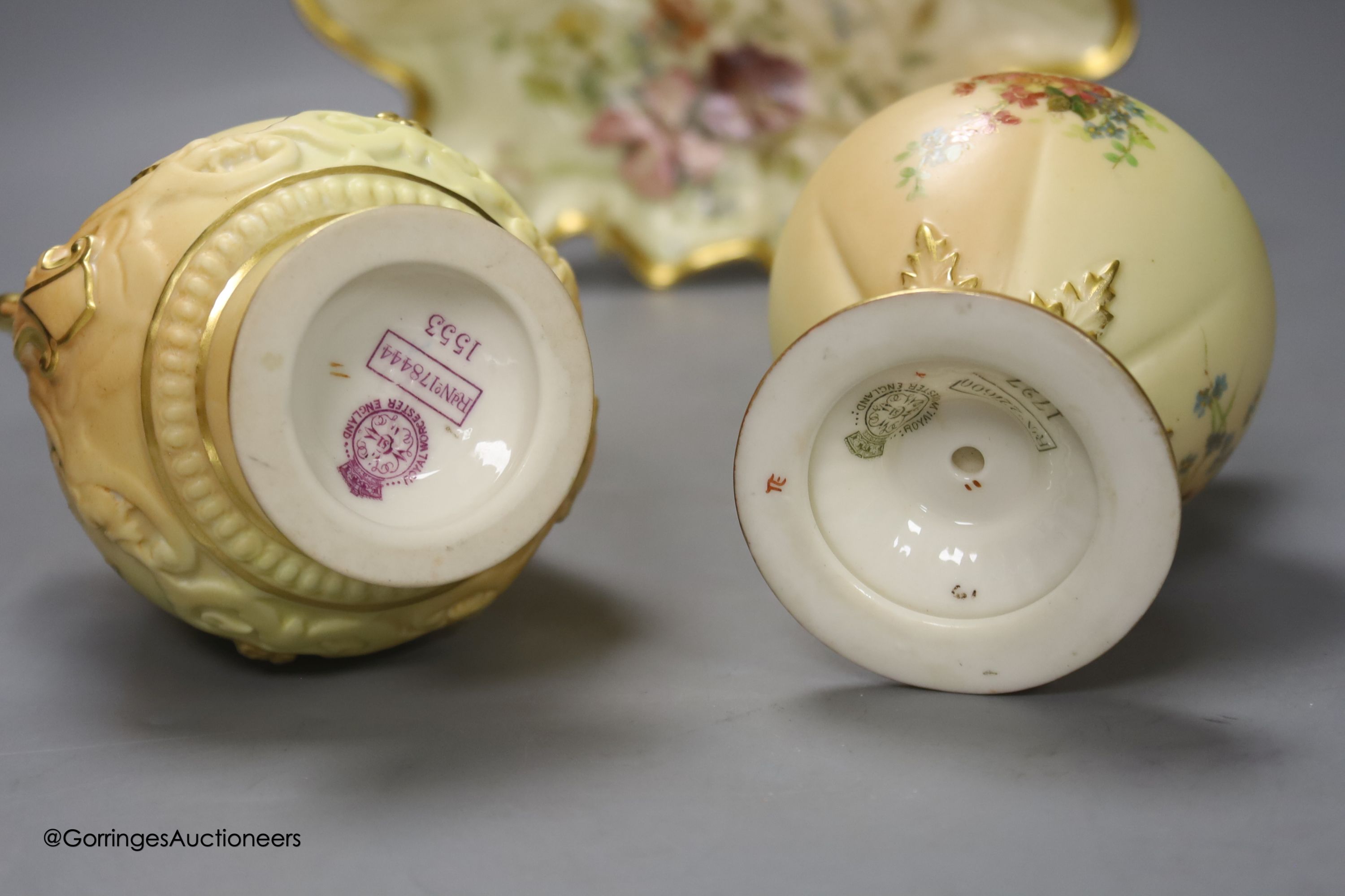 A Royal Worcester blush leaf dish, a pair of ewers, a two handled vase and another